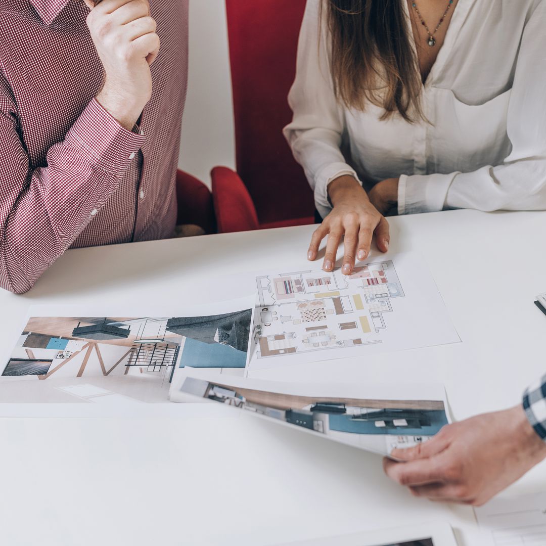 Real Estate Agency. Couple Looking at a Model of Their New Home